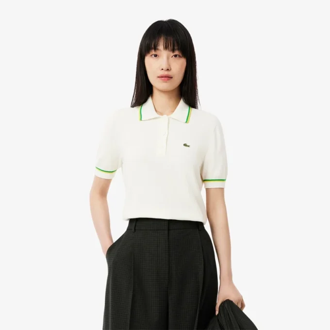 Damen-Poloshirt aus nahtloser 3D-Stretch-Baumwolle in verkürzter Passform Damen-Poloshirt aus nahtloser 3D-Stretch-Baumwolle in verkürzter Passform