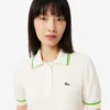 Damen-Poloshirt aus nahtloser 3D-Stretch-Baumwolle in verkürzter Passform Damen-Poloshirt aus nahtloser 3D-Stretch-Baumwolle in verkürzter Passform