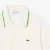 Damen-Poloshirt aus nahtloser 3D-Stretch-Baumwolle in verkürzter Passform Damen-Poloshirt aus nahtloser 3D-Stretch-Baumwolle in verkürzter Passform