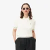 Damen-Poloshirt aus nahtloser 3D-Stretch-Baumwolle in verkürzter Passform Damen-Poloshirt aus nahtloser 3D-Stretch-Baumwolle in verkürzter Passform