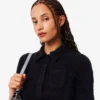 Damen-Poloshirt mit schmaler Passform aus flauschigem Rippstrick Damen-Poloshirt mit schmaler Passform aus flauschigem Rippstrick