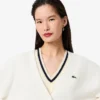 Damen-Strickjacke aus Baumwolle mit V-Ausschnitt und Moosmaschenmuster Damen-Strickjacke aus Baumwolle mit V-Ausschnitt und Moosmaschenmuster