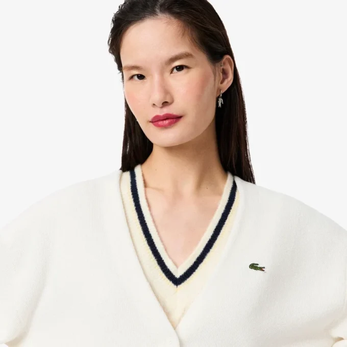 Damen-Strickjacke aus Baumwolle mit V-Ausschnitt und Moosmaschenmuster Damen-Strickjacke aus Baumwolle mit V-Ausschnitt und Moosmaschenmuster