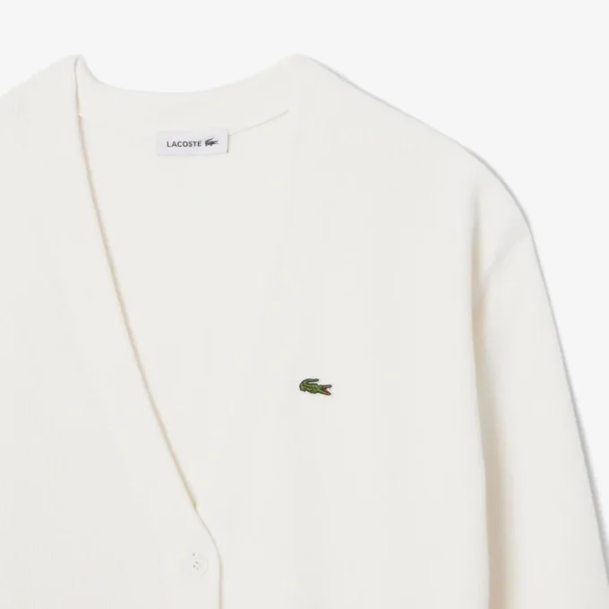 Damen-Strickjacke aus Baumwolle mit V-Ausschnitt und Moosmaschenmuster Damen-Strickjacke aus Baumwolle mit V-Ausschnitt und Moosmaschenmuster
