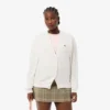 Damen-Strickjacke aus Baumwolle mit V-Ausschnitt und Moosmaschenmuster Damen-Strickjacke aus Baumwolle mit V-Ausschnitt und Moosmaschenmuster