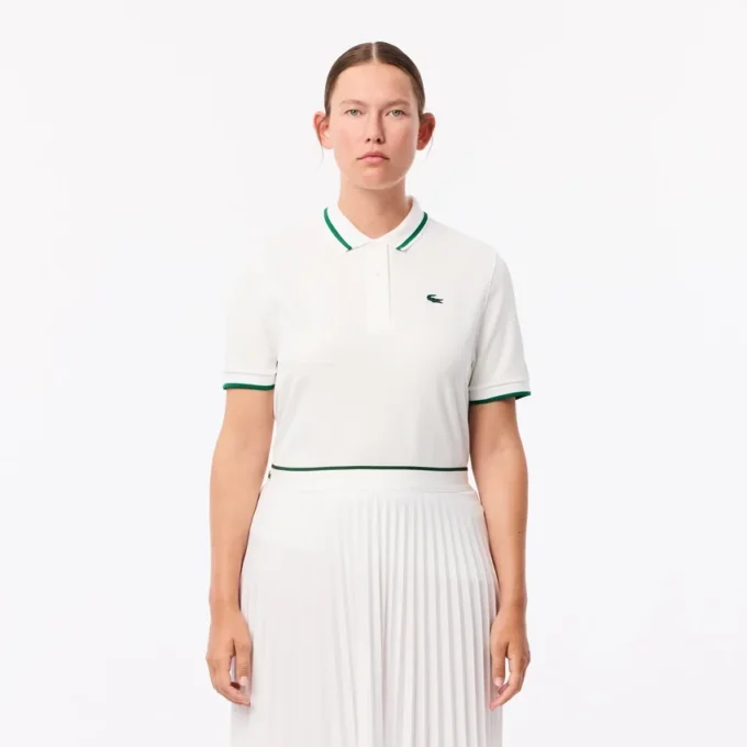 Damen-Tennis-Poloshirt mit UV-Schutz und gestreiftem Kragen Damen-Tennis-Poloshirt mit UV-Schutz und gestreiftem Kragen
