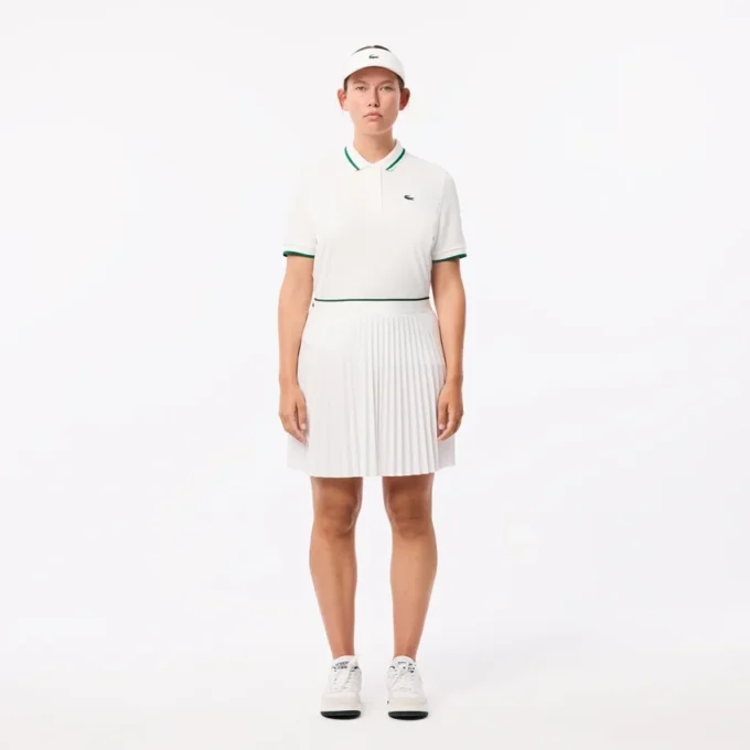 Damen-Tennis-Poloshirt mit UV-Schutz und gestreiftem Kragen Damen-Tennis-Poloshirt mit UV-Schutz und gestreiftem Kragen