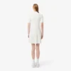 Damenkleid mit Plissee und Poloshirt-Kragen Damenkleid mit Plissee und Poloshirt-Kragen