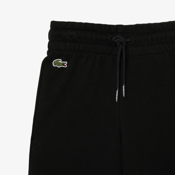 Fleece-Jogginghose für Mädchen mit ausgestelltem Bein Fleece-Jogginghose für Mädchen mit ausgestelltem Bein