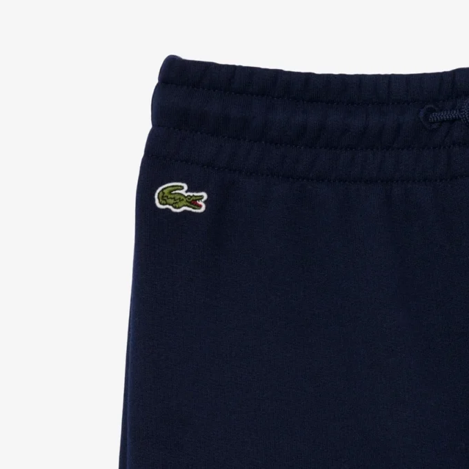 Fleece-Jogginghose für Mädchen mit ausgestelltem Bein Fleece-Jogginghose für Mädchen mit ausgestelltem Bein