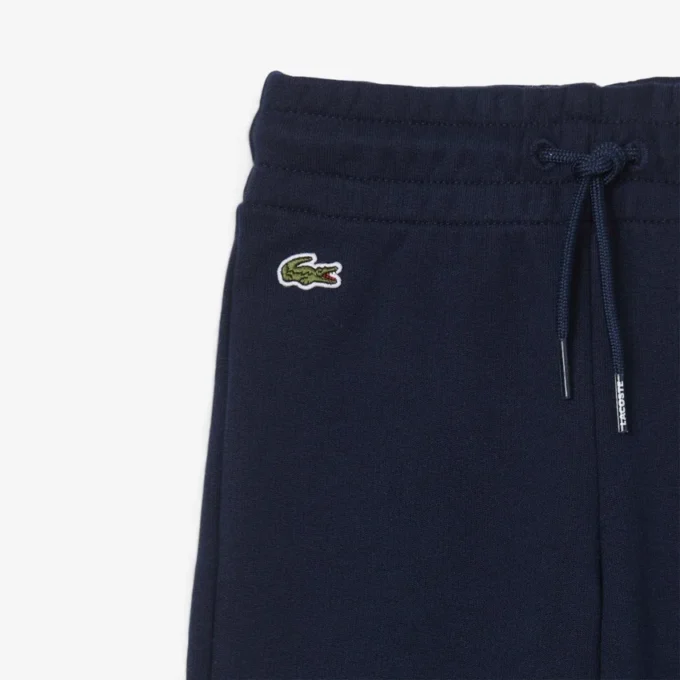 Fleece-Jogginghose für Mädchen mit ausgestelltem Bein Fleece-Jogginghose für Mädchen mit ausgestelltem Bein