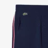 Gestreifte Damen-Jogginghose mit ausgestelltem Bein Gestreifte Damen-Jogginghose mit ausgestelltem Bein