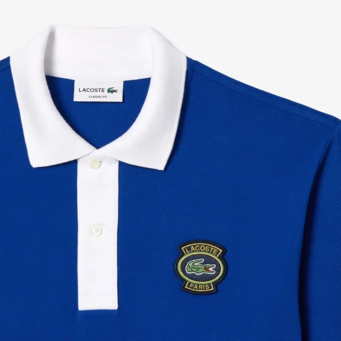 Herren-Poloshirt L.12.12 mit Badge in klassischer Passform Herren-Poloshirt L.12.12 mit Badge in klassischer Passform