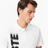 Herren-Poloshirt mit Regular Fit und „Lacoste Movement“-Print