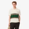 Herren-Poloshirt mit Streifen in klassischer Passform, hergestellt in Frankreich Herren-Poloshirt mit Streifen in klassischer Passform, hergestellt in Frankreich