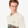 Herren-Poloshirt mit Streifen in klassischer Passform, hergestellt in Frankreich Herren-Poloshirt mit Streifen in klassischer Passform, hergestellt in Frankreich