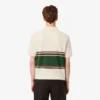 Herren-Poloshirt mit Streifen in klassischer Passform, hergestellt in Frankreich Herren-Poloshirt mit Streifen in klassischer Passform, hergestellt in Frankreich