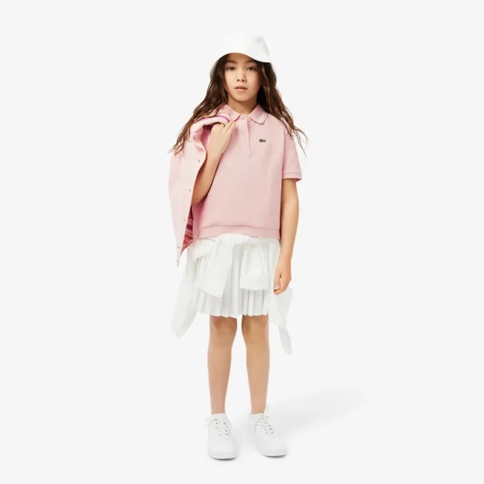 Kinder-Piqué-Poloshirt mit Falten am Rücken Kinder-Piqué-Poloshirt mit Falten am Rücken