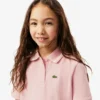 Kinder-Piqué-Poloshirt mit Falten am Rücken Kinder-Piqué-Poloshirt mit Falten am Rücken