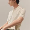 Klassisch geschnittenes Strick-Poloshirt Klassisch geschnittenes Strick-Poloshirt