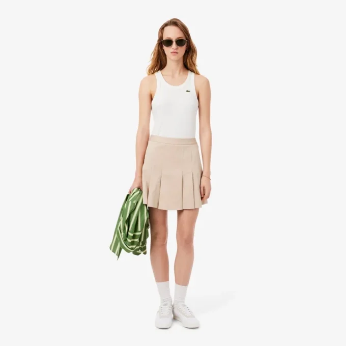 Kurzer Plisseerock aus Stretch-Baumwolle für Damen Kurzer Plisseerock aus Stretch-Baumwolle für Damen