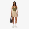 Kurzer Plisseerock aus Stretch-Baumwolle für Damen Kurzer Plisseerock aus Stretch-Baumwolle für Damen