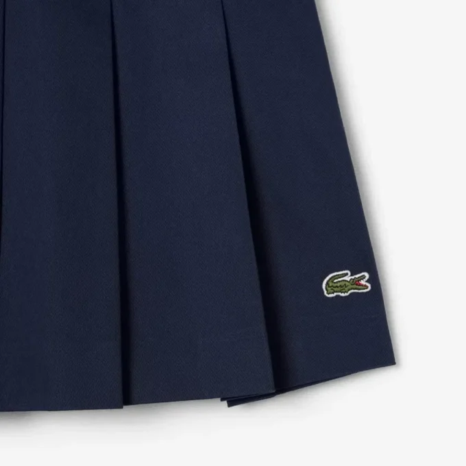 Kurzer Plisseerock aus Stretch-Baumwolle für Damen Kurzer Plisseerock aus Stretch-Baumwolle für Damen