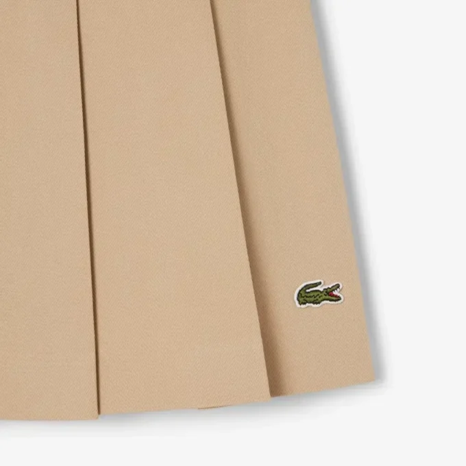 Kurzer Plisseerock aus Stretch-Baumwolle für Damen Kurzer Plisseerock aus Stretch-Baumwolle für Damen