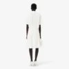 Runway-Poloshirt-Kleid mit Plissee und Stickerei Runway-Poloshirt-Kleid mit Plissee und Stickerei