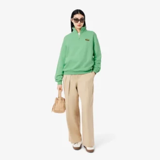 Unisex-Sweatshirt mit halbem Reißverschluss, lockerer Passform und Emblem-Akzent
