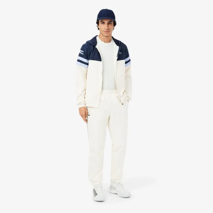 Wasserabweisende Herren-Tennisjacke mit Kapuze Wasserabweisende Herren-Tennisjacke mit Kapuze