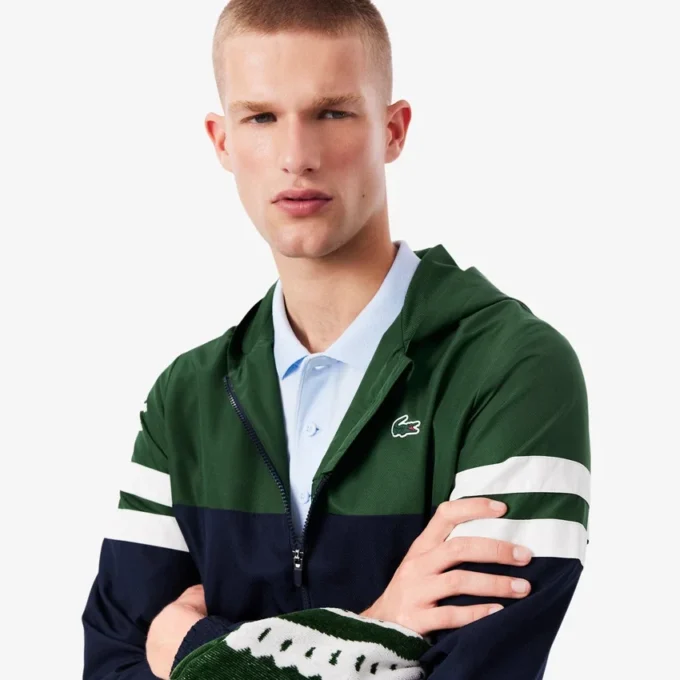 Wasserabweisende Herren-Tennisjacke mit Kapuze Wasserabweisende Herren-Tennisjacke mit Kapuze