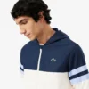 Wasserabweisende Herren-Tennisjacke mit Kapuze Wasserabweisende Herren-Tennisjacke mit Kapuze