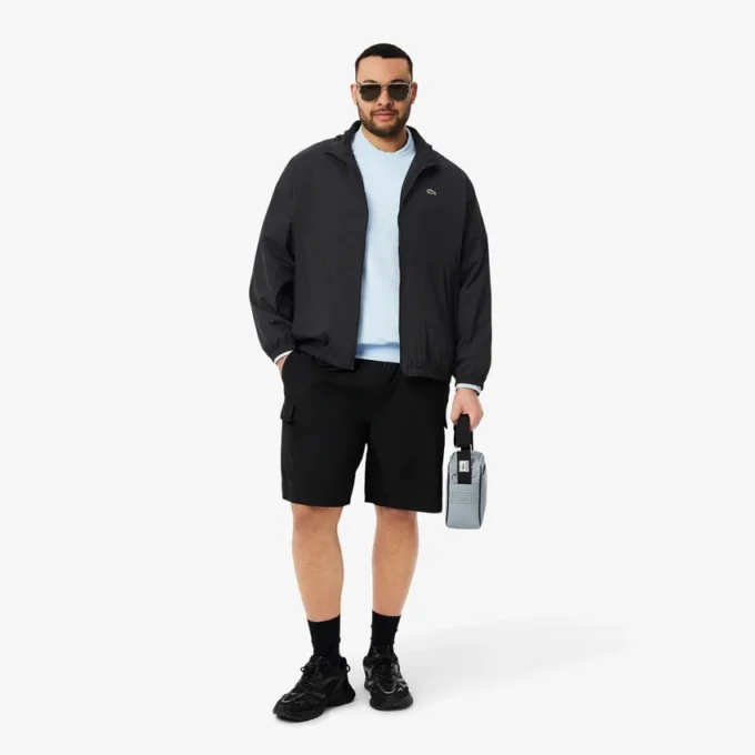 Wasserabweisende Herren-Trainingsjacke mit Kapuze Wasserabweisende Herren-Trainingsjacke mit Kapuze
