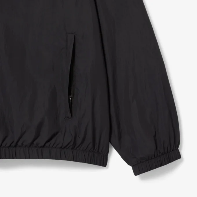 Wasserabweisende Herren-Trainingsjacke mit Kapuze Wasserabweisende Herren-Trainingsjacke mit Kapuze