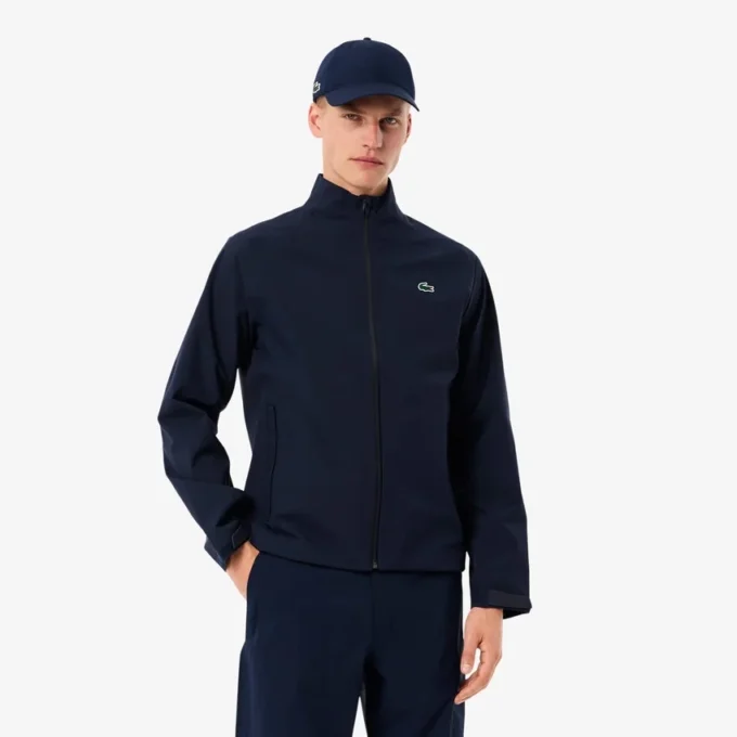 Wasserabweisende Stretch-Windjacke für Herren beim Golf Wasserabweisende Stretch-Windjacke für Herren beim Golf