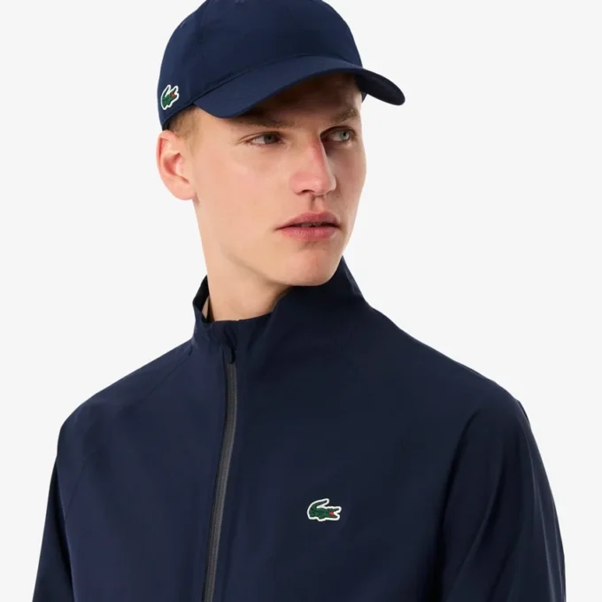 Wasserabweisende Stretch-Windjacke für Herren beim Golf Wasserabweisende Stretch-Windjacke für Herren beim Golf