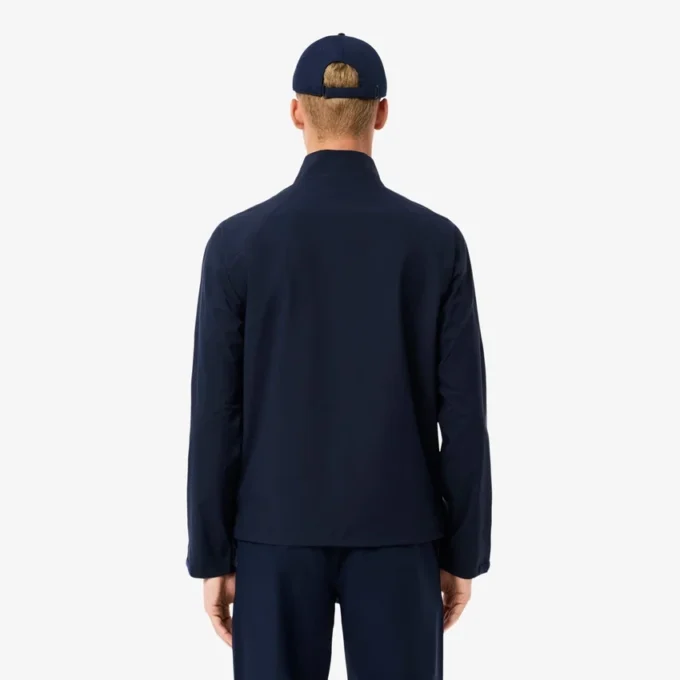 Wasserabweisende Stretch-Windjacke für Herren beim Golf Wasserabweisende Stretch-Windjacke für Herren beim Golf
