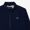 Wasserabweisende Stretch-Windjacke für Herren beim Golf Wasserabweisende Stretch-Windjacke für Herren beim Golf