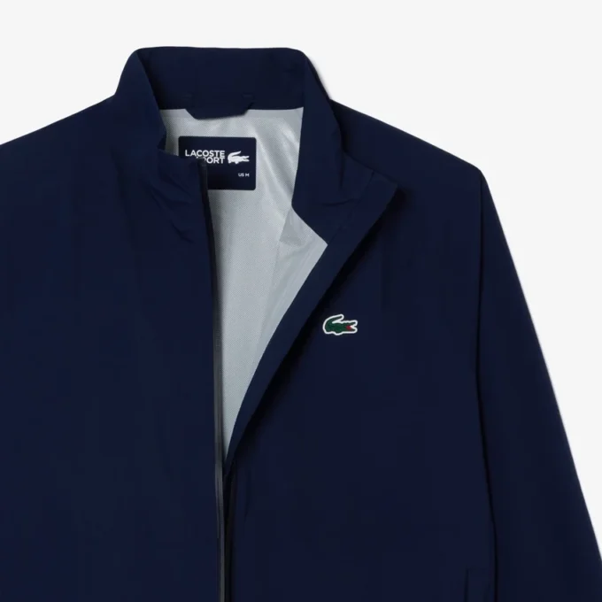 Wasserabweisende Stretch-Windjacke für Herren beim Golf Wasserabweisende Stretch-Windjacke für Herren beim Golf