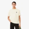 Weit geschnittenes Fleece-Poloshirt mit Emblem Weit geschnittenes Fleece-Poloshirt mit Emblem