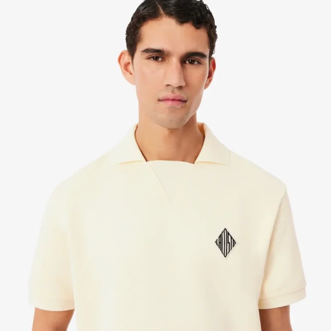 Weit geschnittenes Fleece-Poloshirt mit Emblem Weit geschnittenes Fleece-Poloshirt mit Emblem